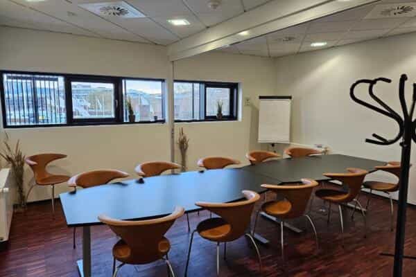 Boardroom setup at Royal Conference featuring organized seating for corporate meeting events.