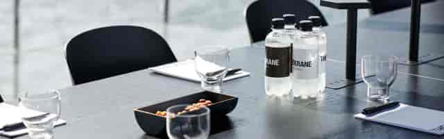 Minimalist boardroom at TheKrane, Copenhagen: professional business meeting setup.