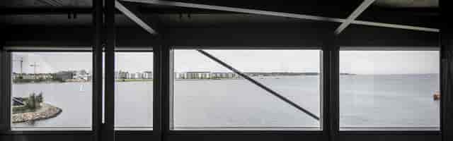 THEKRANE room with floor-to-ceiling waterfront views for corporate events and executive retreats.
