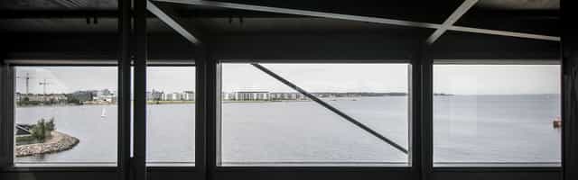 THEKRANE room with floor-to-ceiling waterfront views for corporate events and executive retreats.