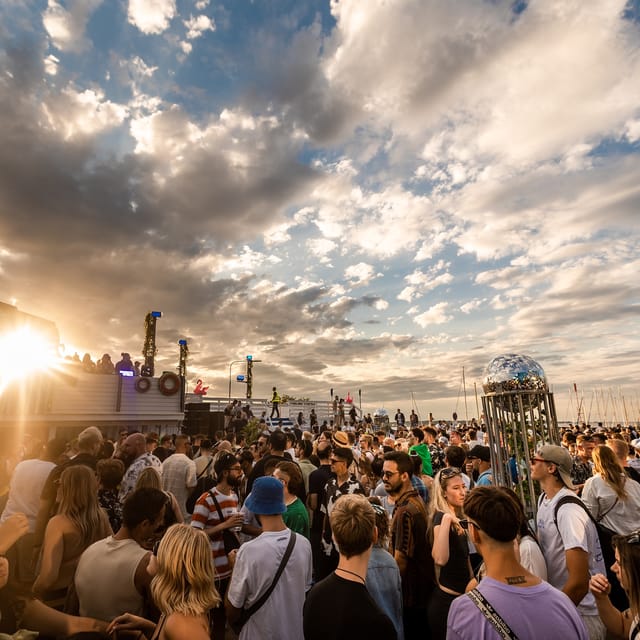 Outdoor festival party at Terminal 13 featuring a large disco ball for events and venue rentals.