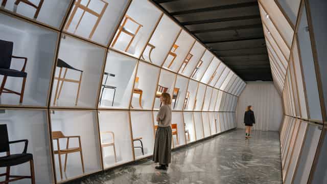 Designmuseum Danmark banquet hall with backlit modular shelving for corporate event exhibitions.