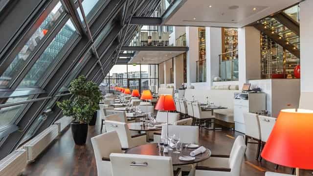 Glass-walled Harbour Hotel restaurant for corporate luncheon or executive networking event.