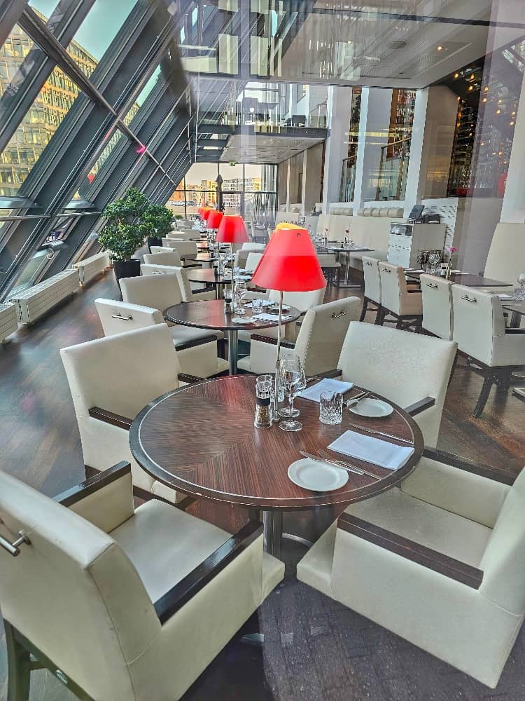 Upscale Harbour Hotel dining room with modern lamps for corporate events and networking luncheons.