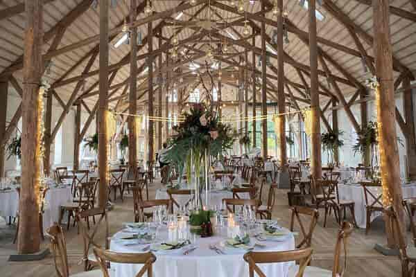 Rustic-chic banquet hall with vaulted timber ceilings for weddings and gala events.