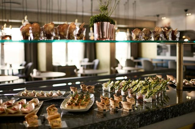 Tivoli theater buffet: Tiered gourmet hors d'oeuvres display for luxury corporate catering events.