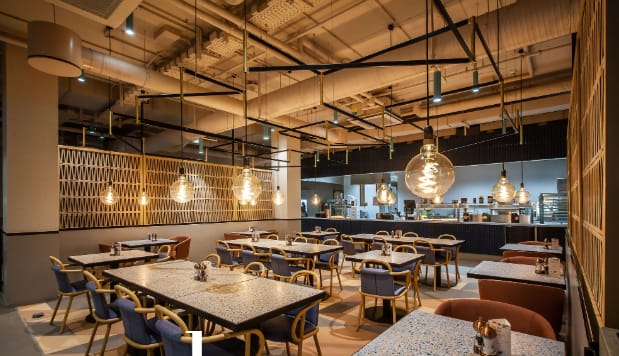 Industrial-chic Chez Marie venue with modular seating for networking mixers and team lunches.
