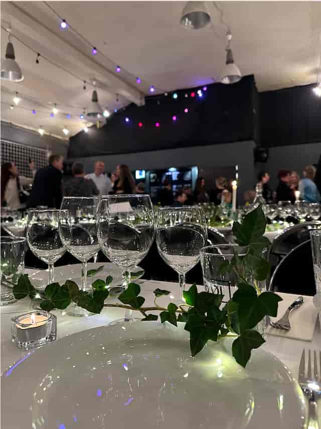 Elegant glassware at KARGO CPH networking mixer, corporate event venue with botanical decor.