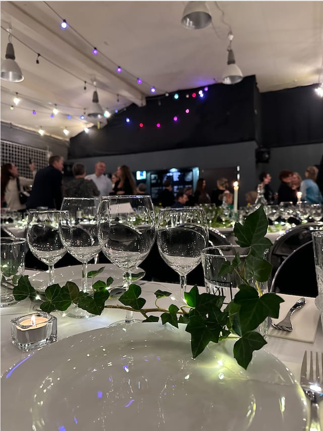 Elegant glassware at KARGO CPH networking mixer, corporate event venue with botanical decor.