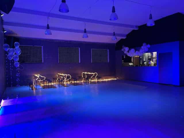 Industrial event space in Frederiksberg with blue lighting for evening reception or lounge party.