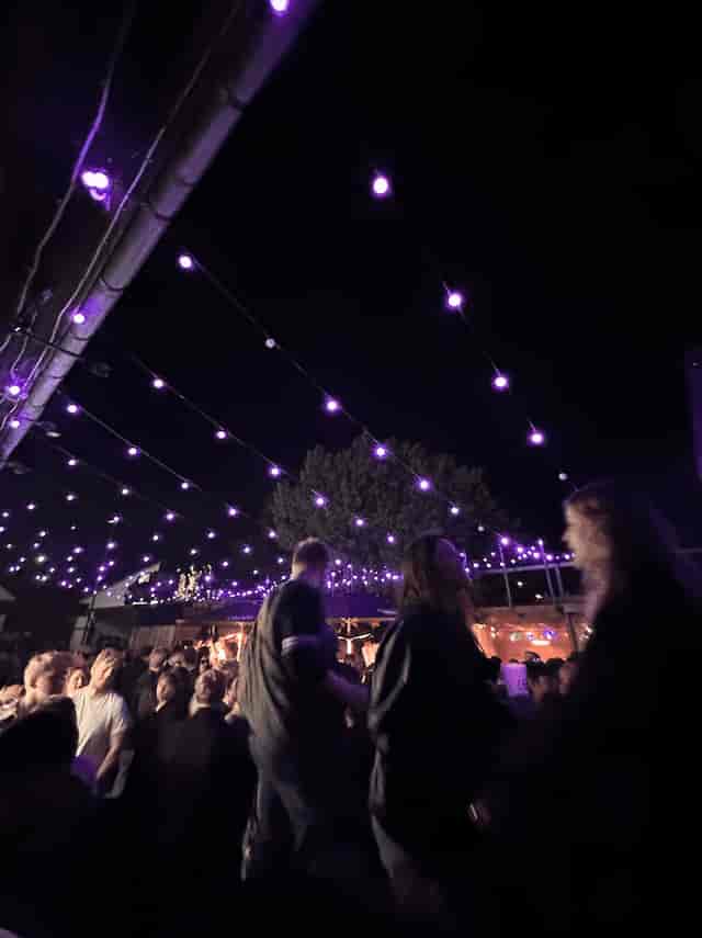Outdoor evening bar at KARGO CPH with bistro lighting for networking reception or social mixer.