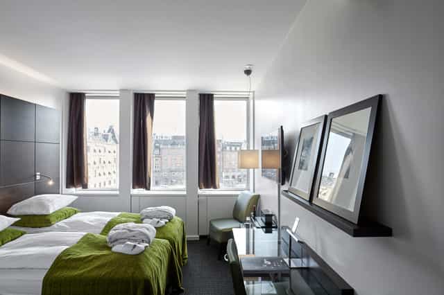 Modern twin-occupancy guest room at Suites in The Square for conference accommodation.