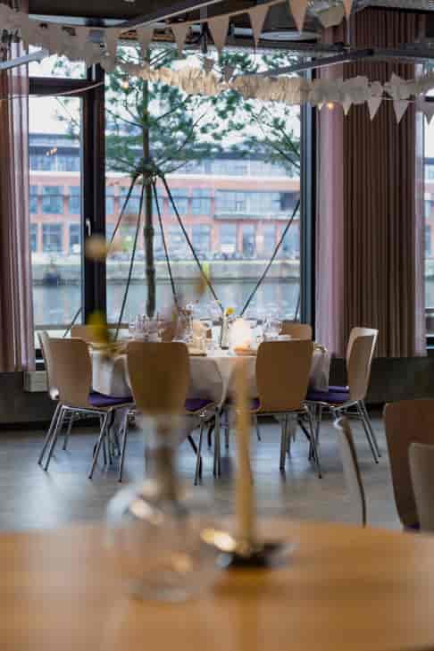 CodeNode event space with industrial-chic waterfront view for corporate and social gatherings.