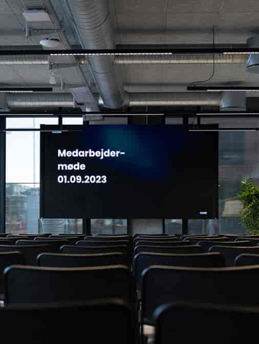 Digital signage in CodeNode conference room for professional corporate meeting and event venue.