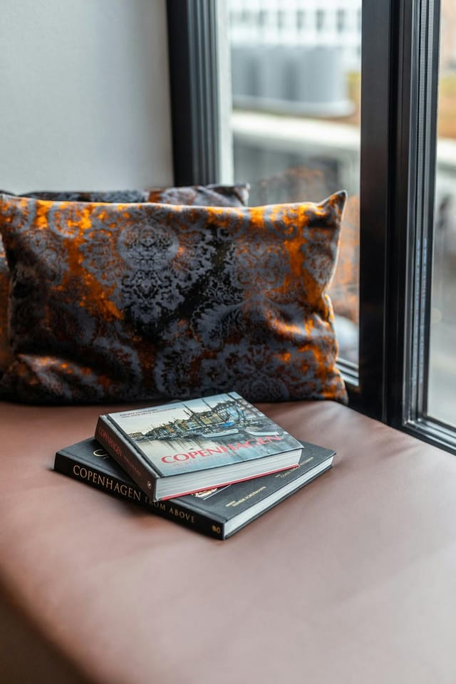 Scandic Nørreport meeting breakout room with sophisticated decor for professional networking.