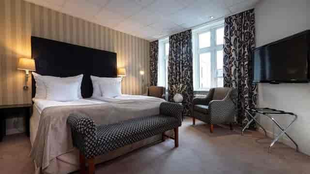 Hotel Mayfair conference room with functional seating area for business travel and events.