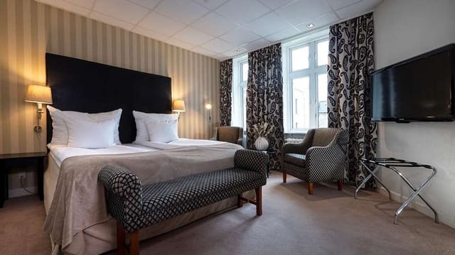 Hotel Mayfair conference room with functional seating area for business travel and events.