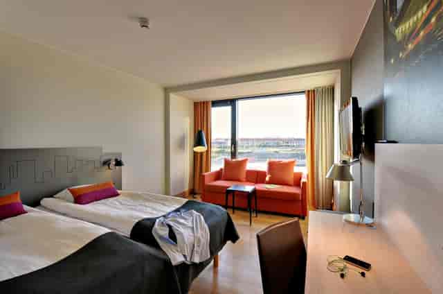 Scandic Sydhavnen guest room with workspace, ideal for business conferences and corporate events.