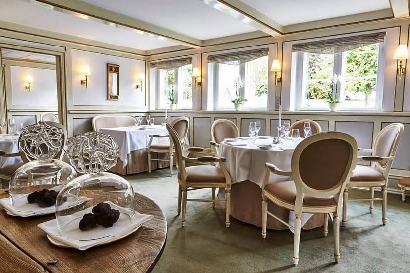 Sophisticated Copenhagen bistro interior, ideal for corporate dinner or executive board lunch.