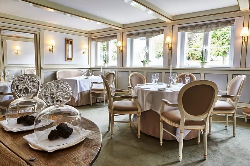 Sophisticated Copenhagen bistro interior, ideal for corporate dinner or executive board lunch.
