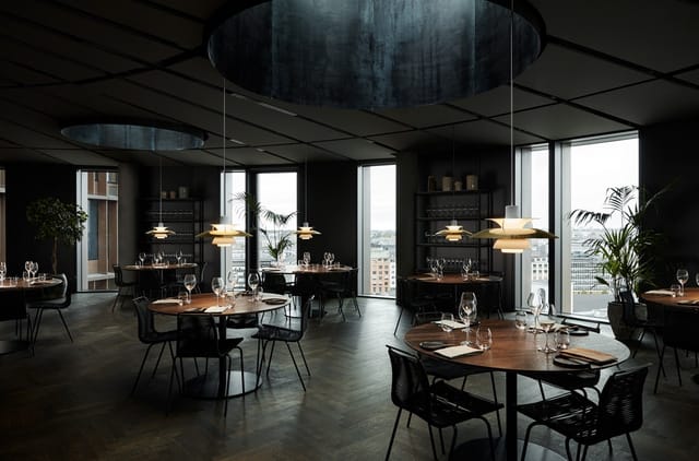 Moody minimalist restaurant space for exclusive boardroom dinners and networking events.