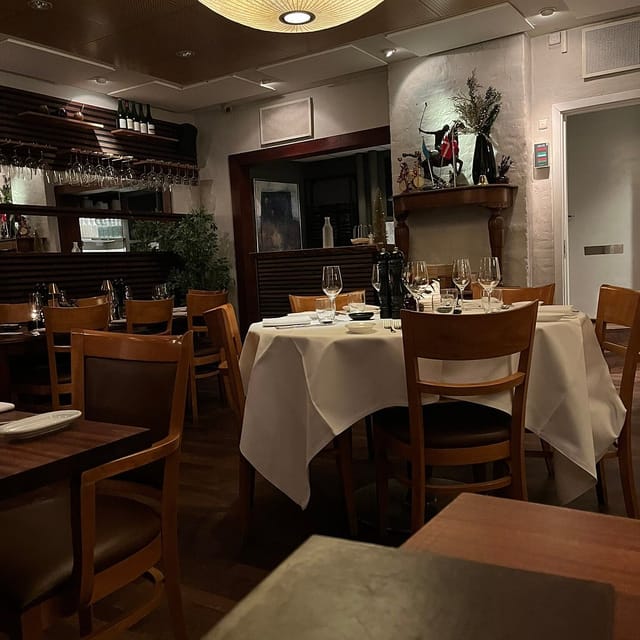 Private dining room with linen-draped tables for board dinners and VIP events.