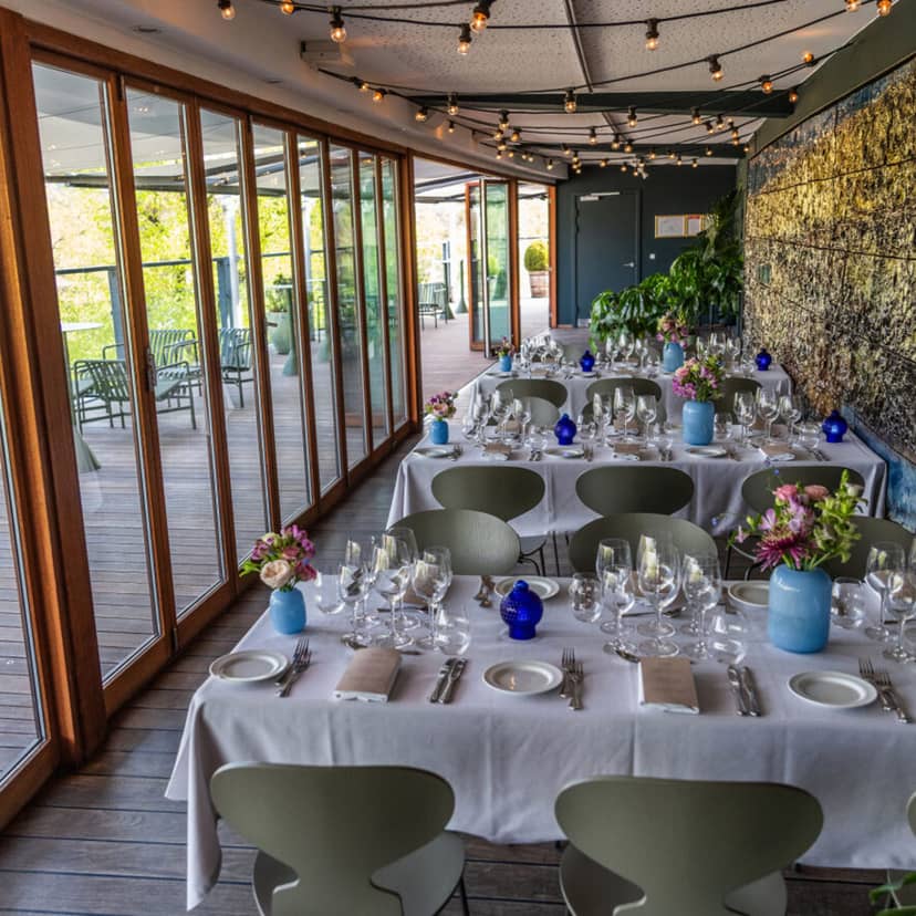 Modern Balanchine Lounge food hall with floor-to-ceiling glass for corporate and social events.