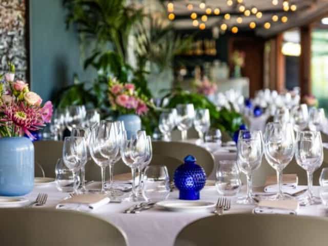 Upscale Balanchine Lounge dining table with floral decor for luxury luncheon or event catering.