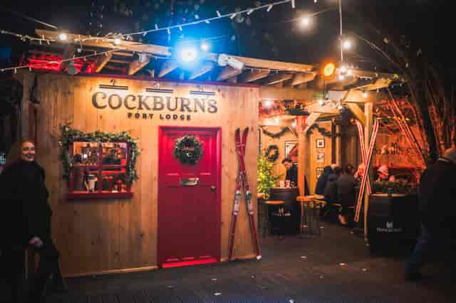 Cozy winter-themed event space at The Knot in Between The Bridges with rustic décor.