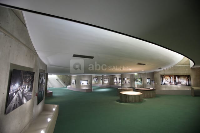 Modern Grand Hall at Espace Niemeyer, featuring circular displays for cocktail events and exhibits.