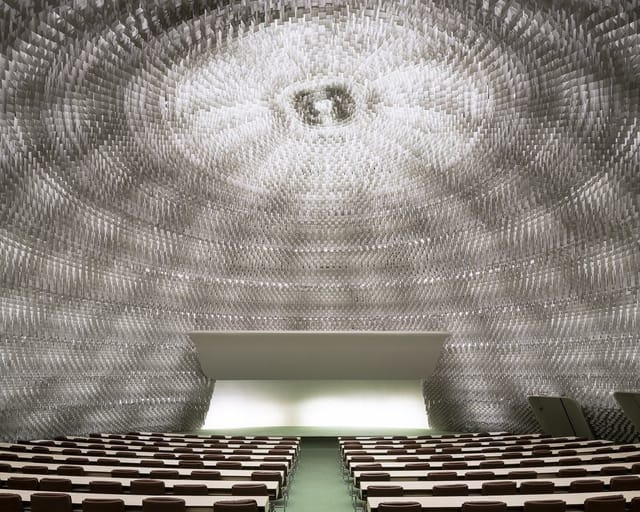 Espace Niemeyer auditorium with textured dome, ideal for keynote presentations and brand events.