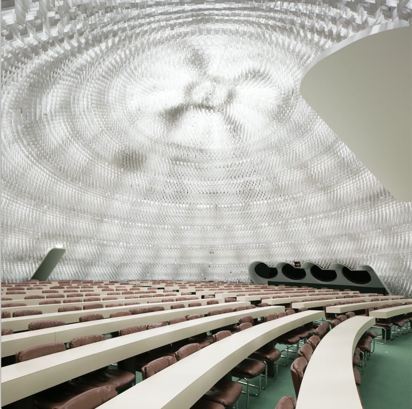 Espace Niemeyer auditorium with iconic dome ceiling for keynote sessions and plenary events.