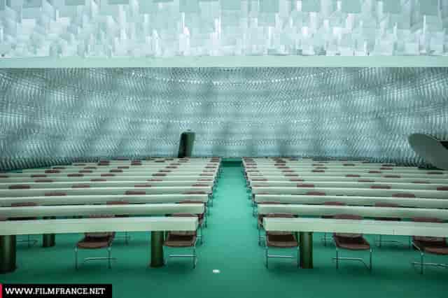 Espace Niemeyer auditorium with textured architecture for keynote conferences and business events.