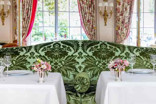 Elegant fine dining room with natural light for corporate luncheons and VIP events.