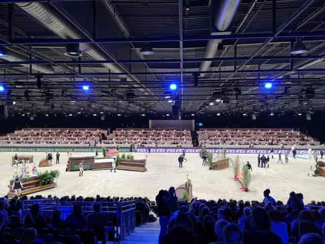 Paris Nord Villepinte equestrian arena with overhead trussing for indoor horse show events.