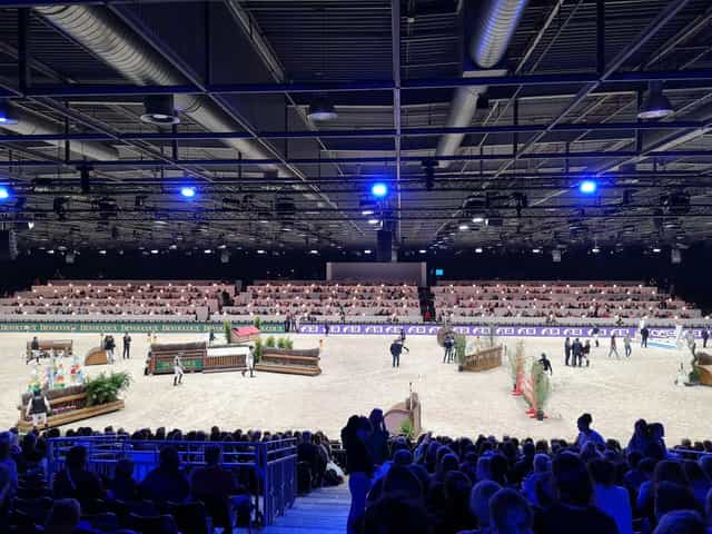 Paris Nord Villepinte equestrian arena with overhead trussing for indoor horse show events.