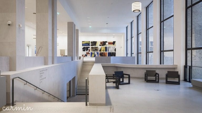 Modern foyer at Musée d'Art Moderne de Paris, tiered layout for cocktail reception or networking.
