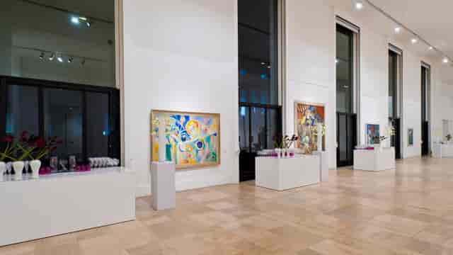 Minimalist gallery reception at Musée d’Art Moderne de Paris with sleek buffets, event venue.