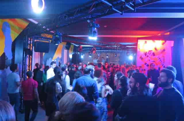 Graffiti-themed networking event at Salon Nijinski with industrial lighting for corporate parties.