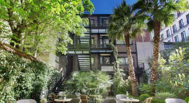 Lush garden at B Montmartre Hotel for cocktail hours and networking events.