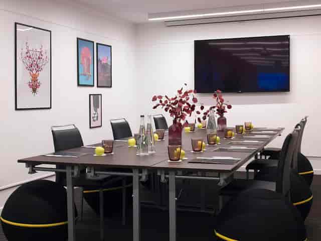 Modern boardroom at Hotel Paris Opéra with AV tech for business meetings and corporate events.