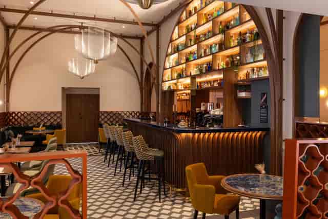 Luxury hotel lounge with backlit bar for VIP networking and boutique event receptions.