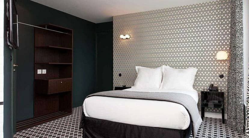 Modern boutique hotel room with efficient storage, perfect for VIP event speakers and attendees.