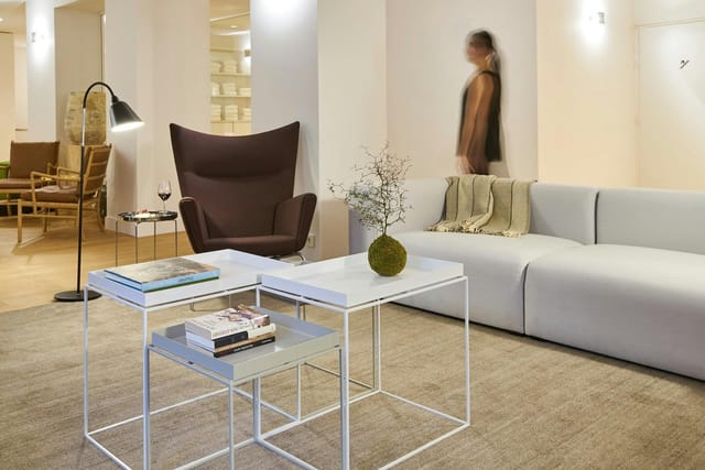 Modern breakout room with modular lounge furniture for business networking and corporate events.