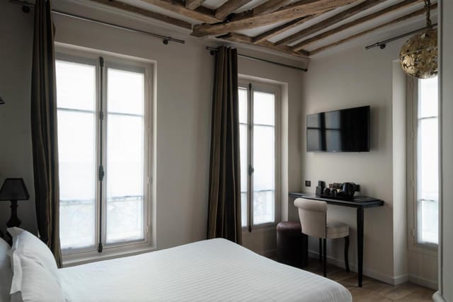 Boutique hotel room with desk for VIP offsite event accommodations and business travel.