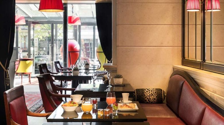 Luxury cafe breakout space with banquette seating for executive networking and VIP events.