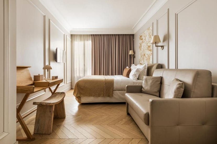 Junior suite at Hotel Maison Pigalle with workspace for VIP event accommodation.