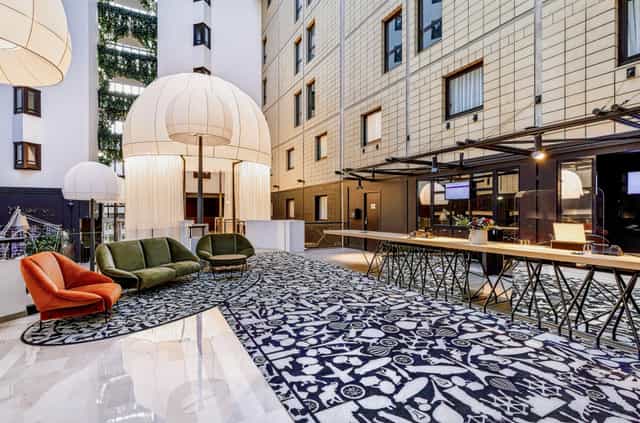 Modern lounge at Porte de Versailles Hotel, ideal for upscale networking and corporate events.
