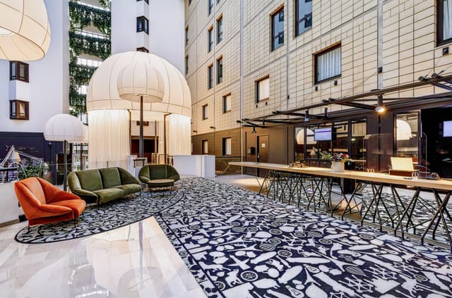 Modern lounge at Porte de Versailles Hotel, ideal for upscale networking and corporate events.