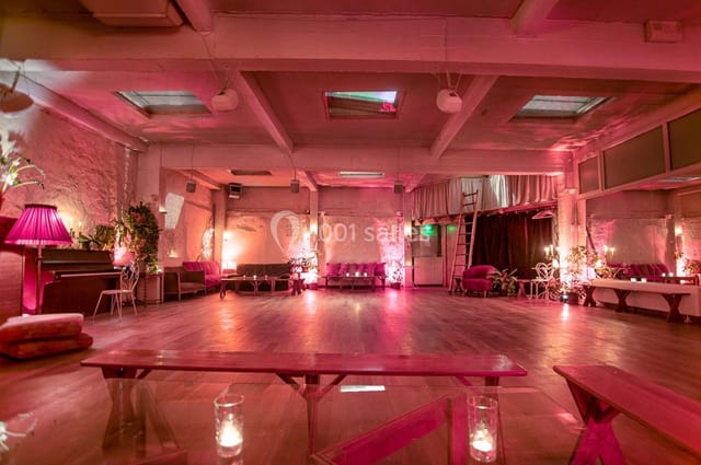 Industrial-chic Loft Lechapelais event space with pink ambient lighting for cocktail receptions.